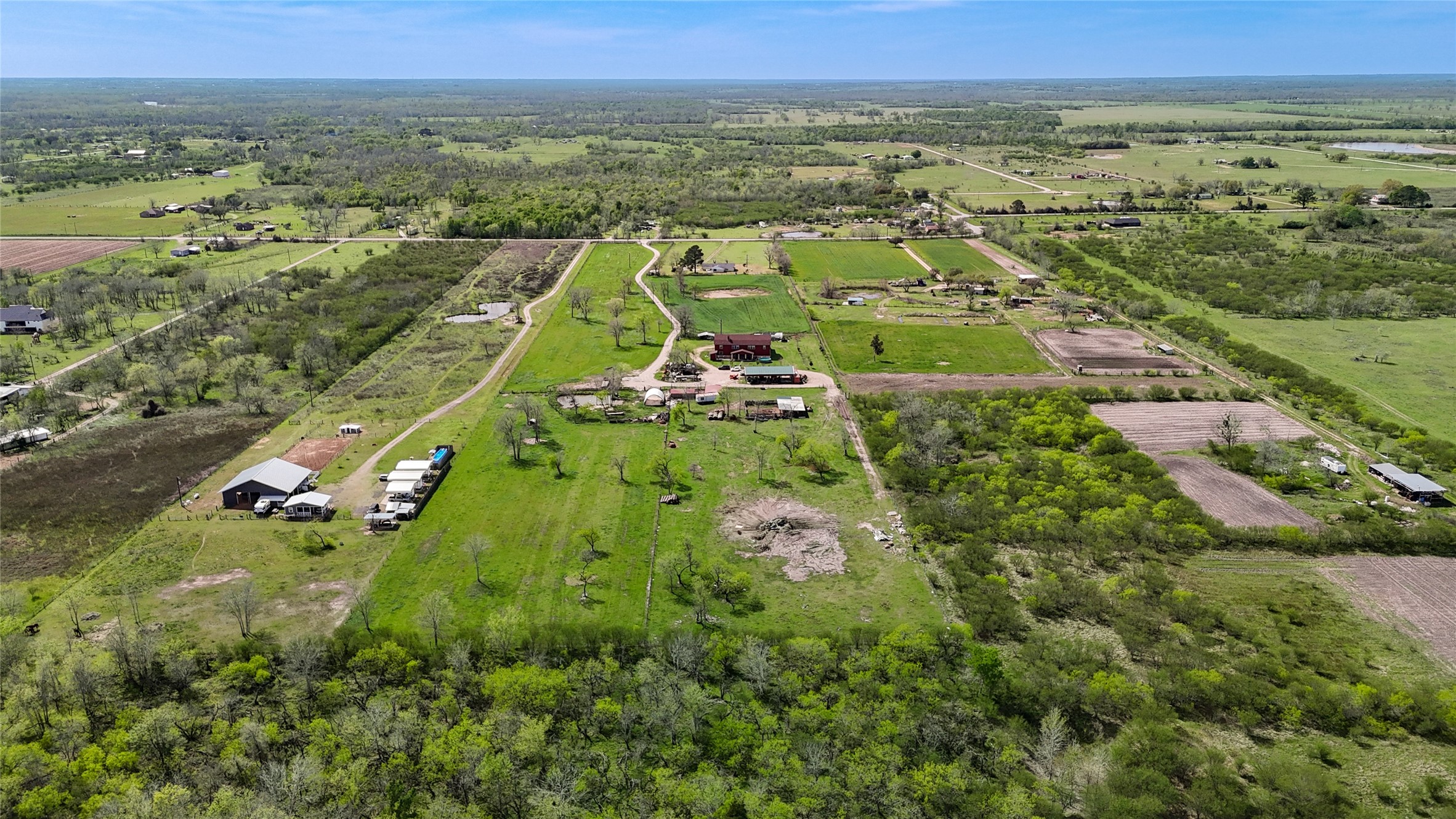 8570 Sunny Side Road Hempstead, TX 77445 - Photo 44 of 50 an aerial view of residential houses with outdoor space and trees