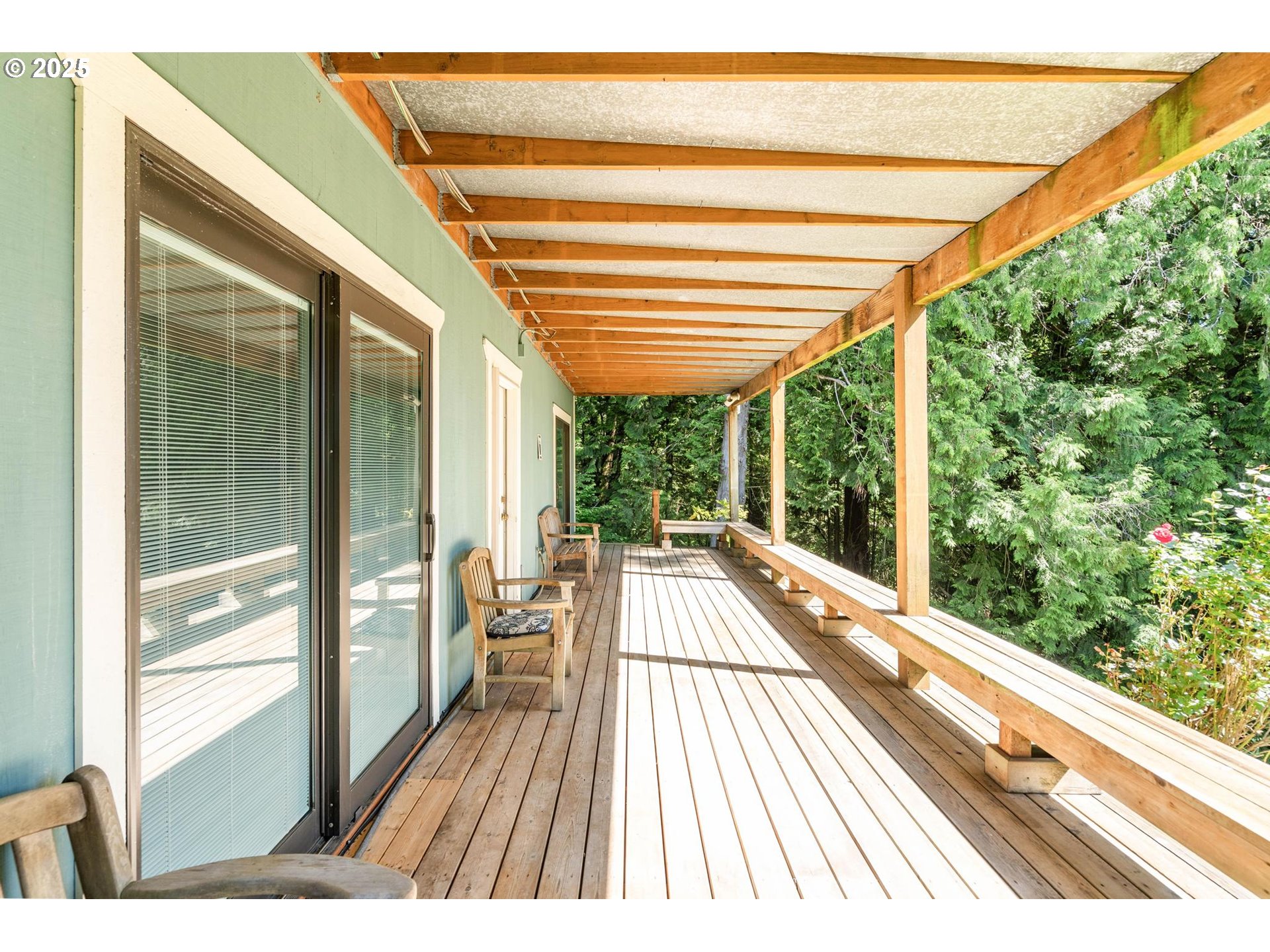 16448 Northwest McNamee Road Portland, OR 97231 - Photo 33 of 48 a view of balcony with a large window and wooden floor