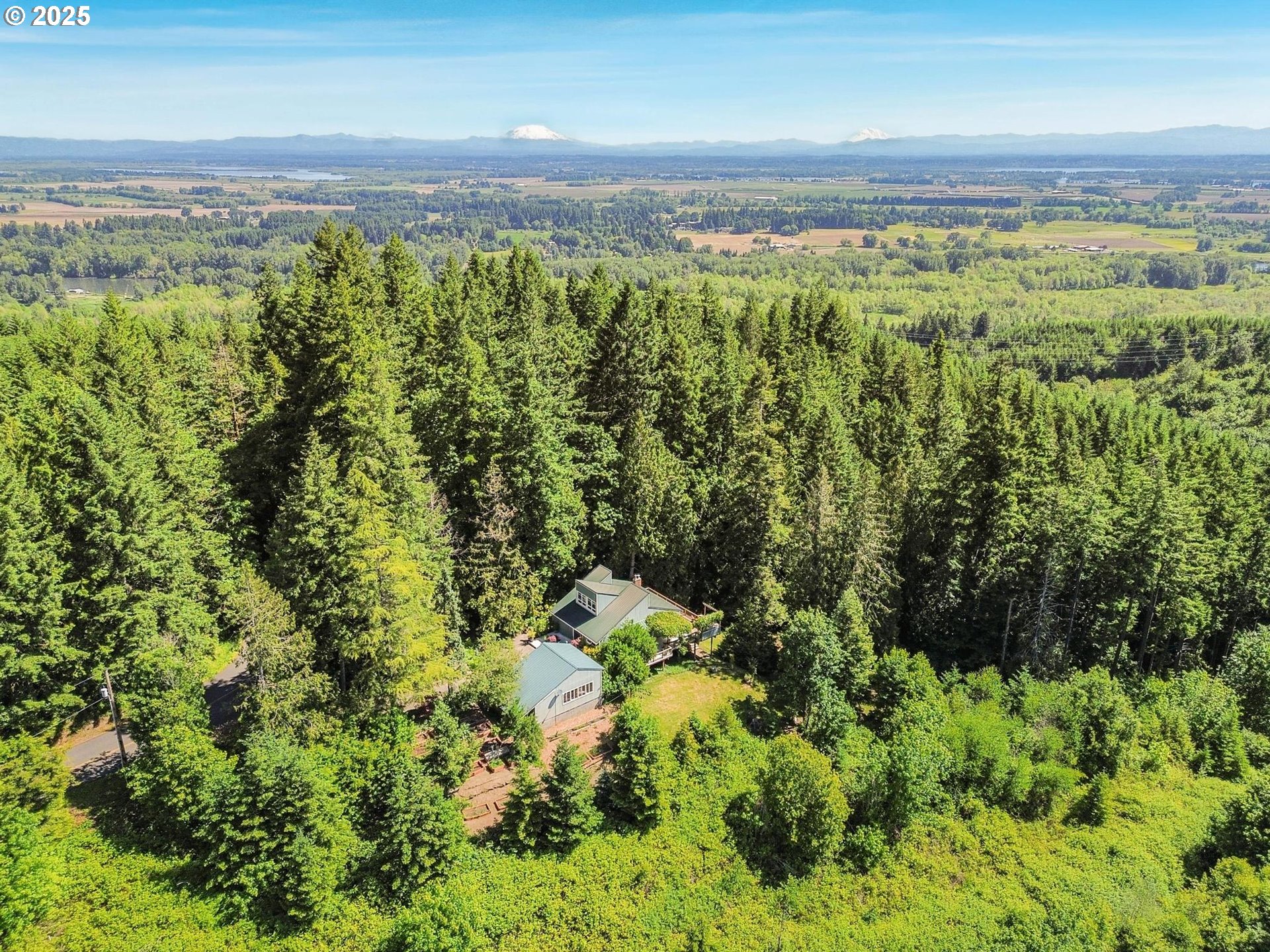 16448 Northwest McNamee Road Portland, OR 97231 - Photo 44 of 48 a view of a city with lush green forest