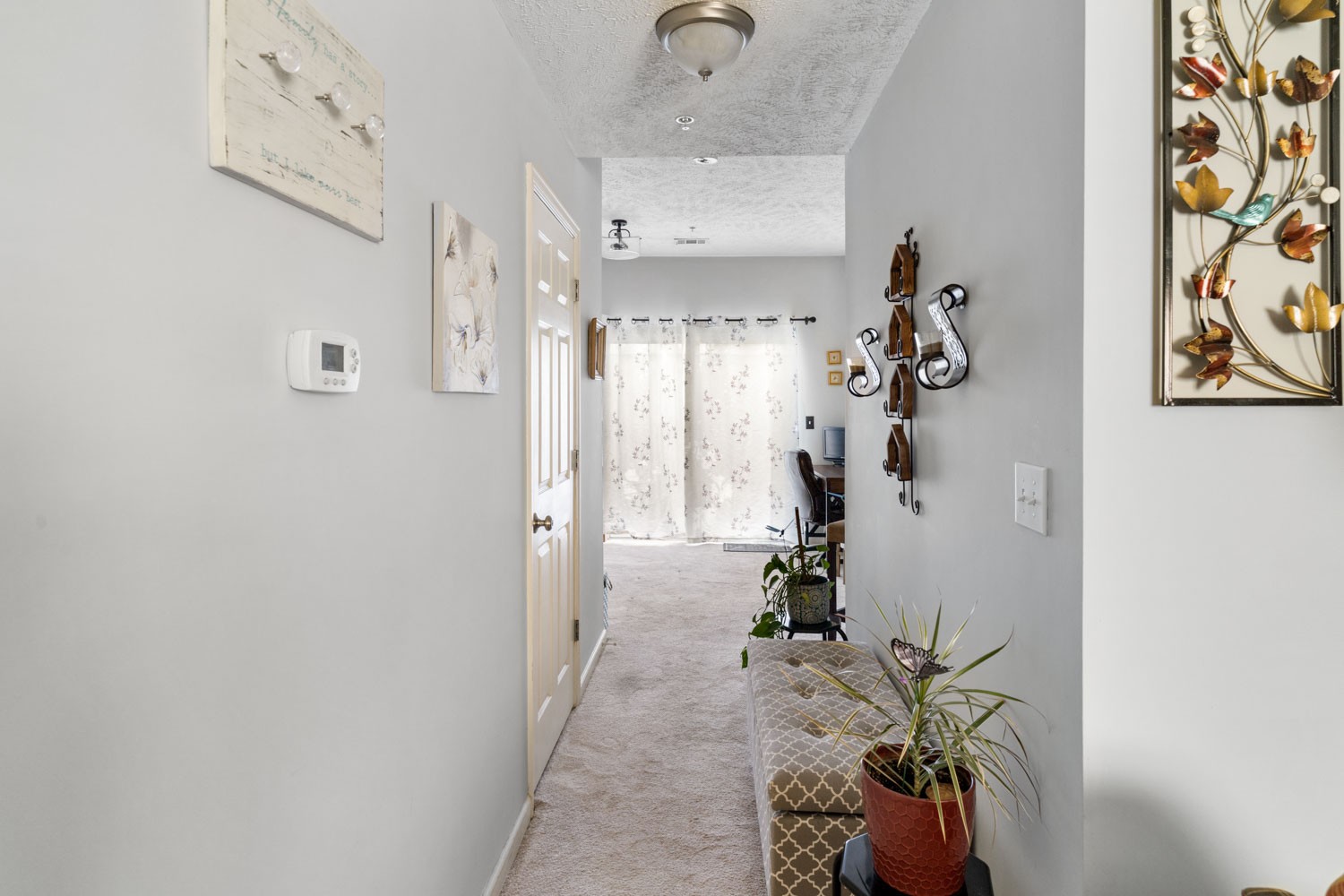 2018 Arum Court Spring Hill, TN 37174 - Photo 12 of 38 a view of a hallway with paintings on the wall