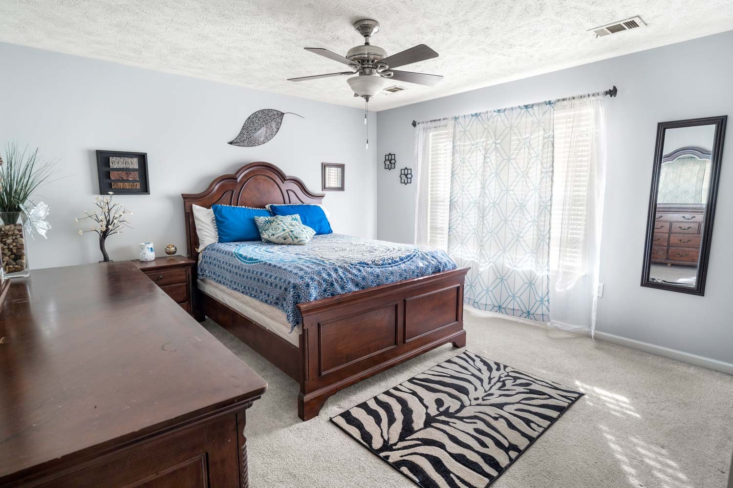 2018 Arum Court Spring Hill, TN 37174 - Photo 21 of 38 a room with a bed and a chandelier