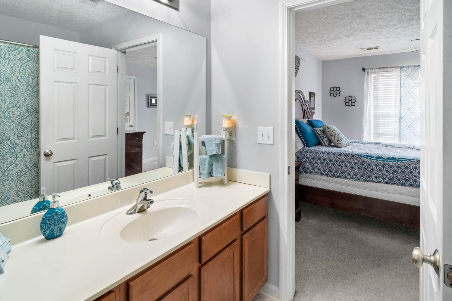 2018 Arum Court Spring Hill, TN 37174 - Photo 25 of 38 a en suite bathroom with a double vanity sink and a mirror