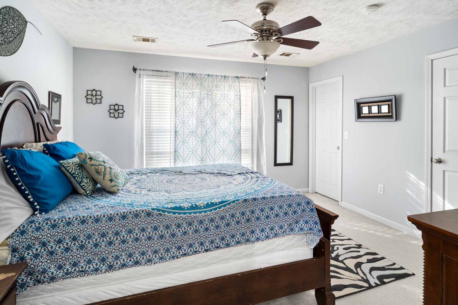 2018 Arum Court Spring Hill, TN 37174 - Photo 26 of 38 a bedroom with a large bed and a chandelier