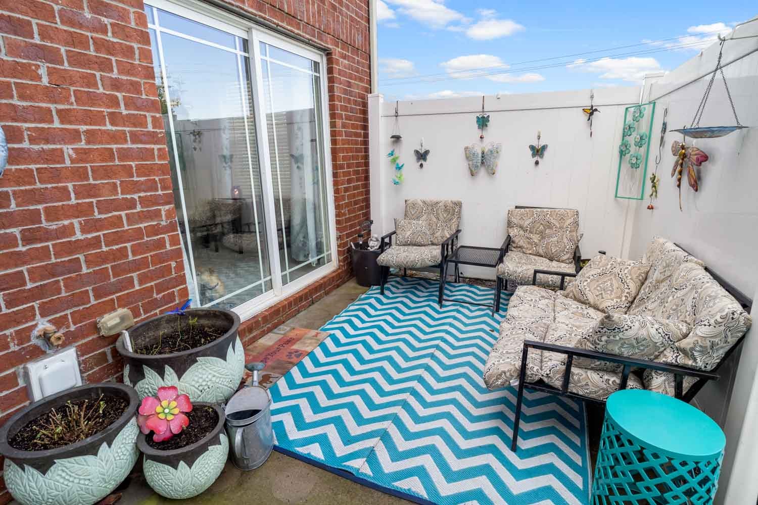 2018 Arum Court Spring Hill, TN 37174 - Photo 34 of 38 a outdoor living space with furniture and a rug