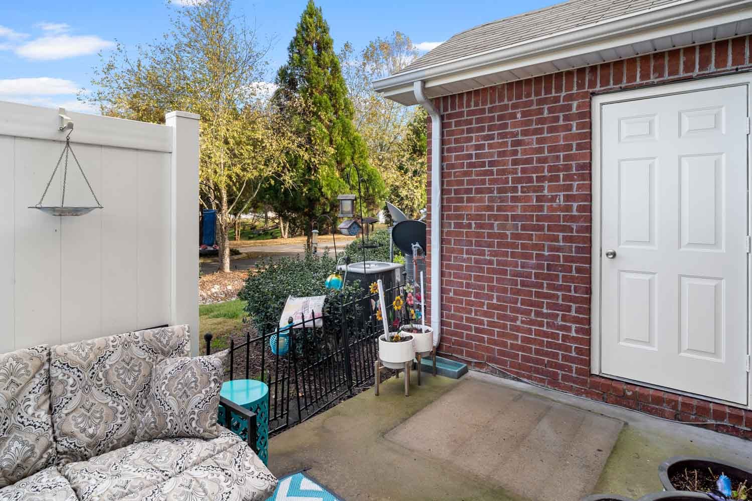 2018 Arum Court Spring Hill, TN 37174 - Photo 36 of 38 a view of backyard with seating space and trees in the background