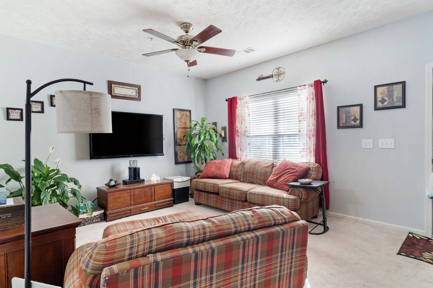 2018 Arum Court Spring Hill, TN 37174 - Photo 6 of 38 a bedroom with a bed a couch and a flat screen tv