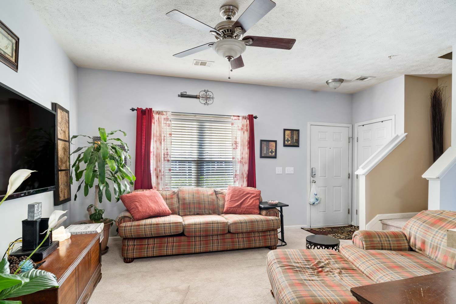 2018 Arum Court Spring Hill, TN 37174 - Photo 7 of 38 a living room with furniture and a flat screen tv