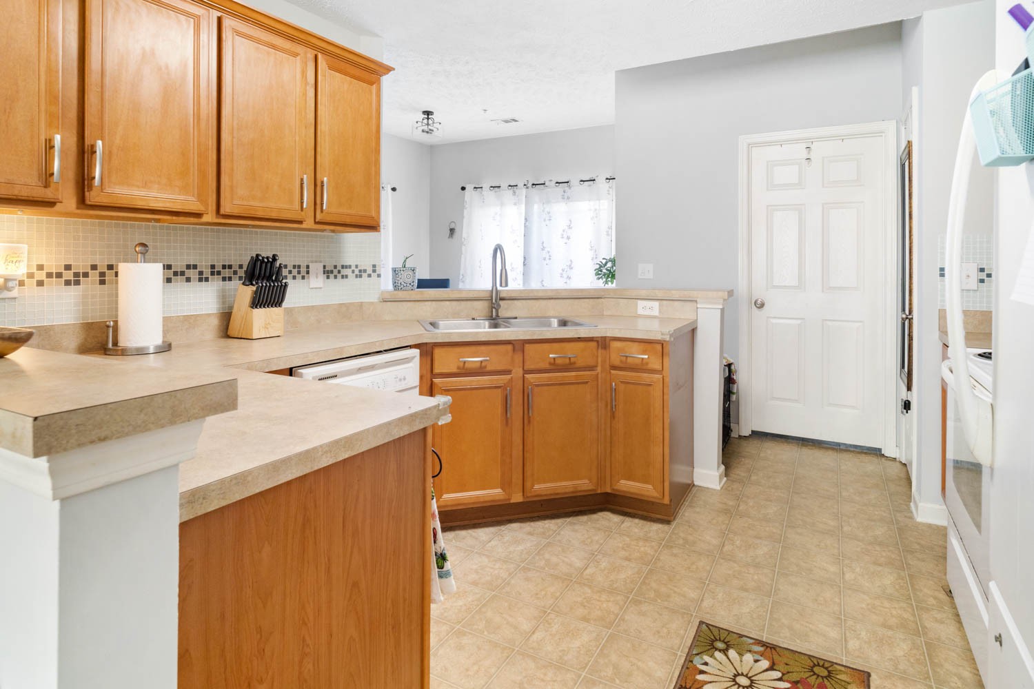 2018 Arum Court Spring Hill, TN 37174 - Photo 10 of 38 a kitchen with stainless steel appliances granite countertop a sink stove and cabinets