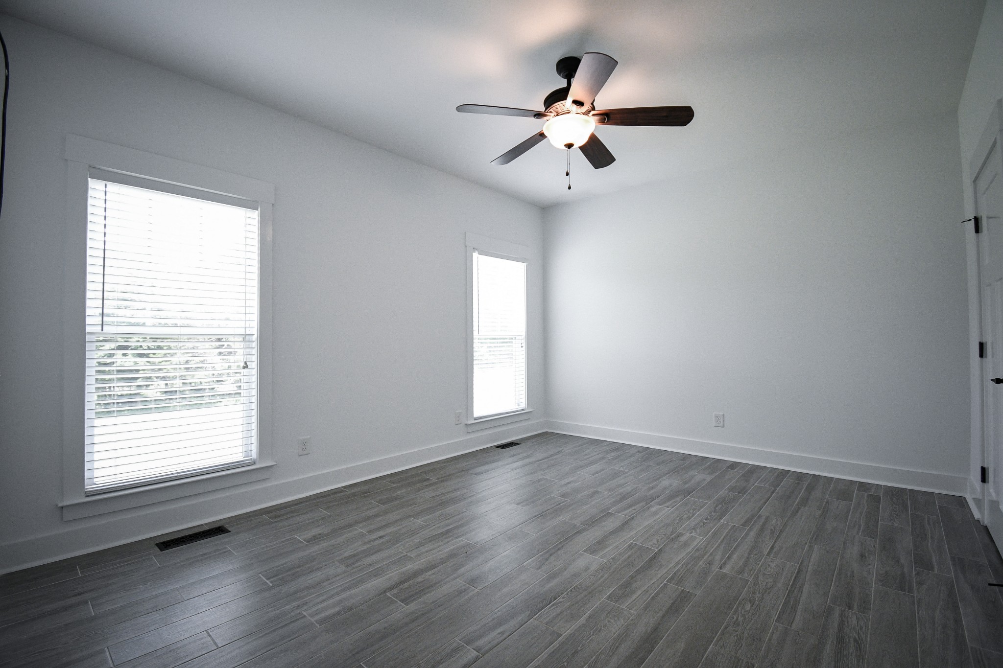 2848 Carpenter Bridge Road Columbia, TN 38401 - Photo 11 of 46 a view of an empty room with wooden floor and a window
