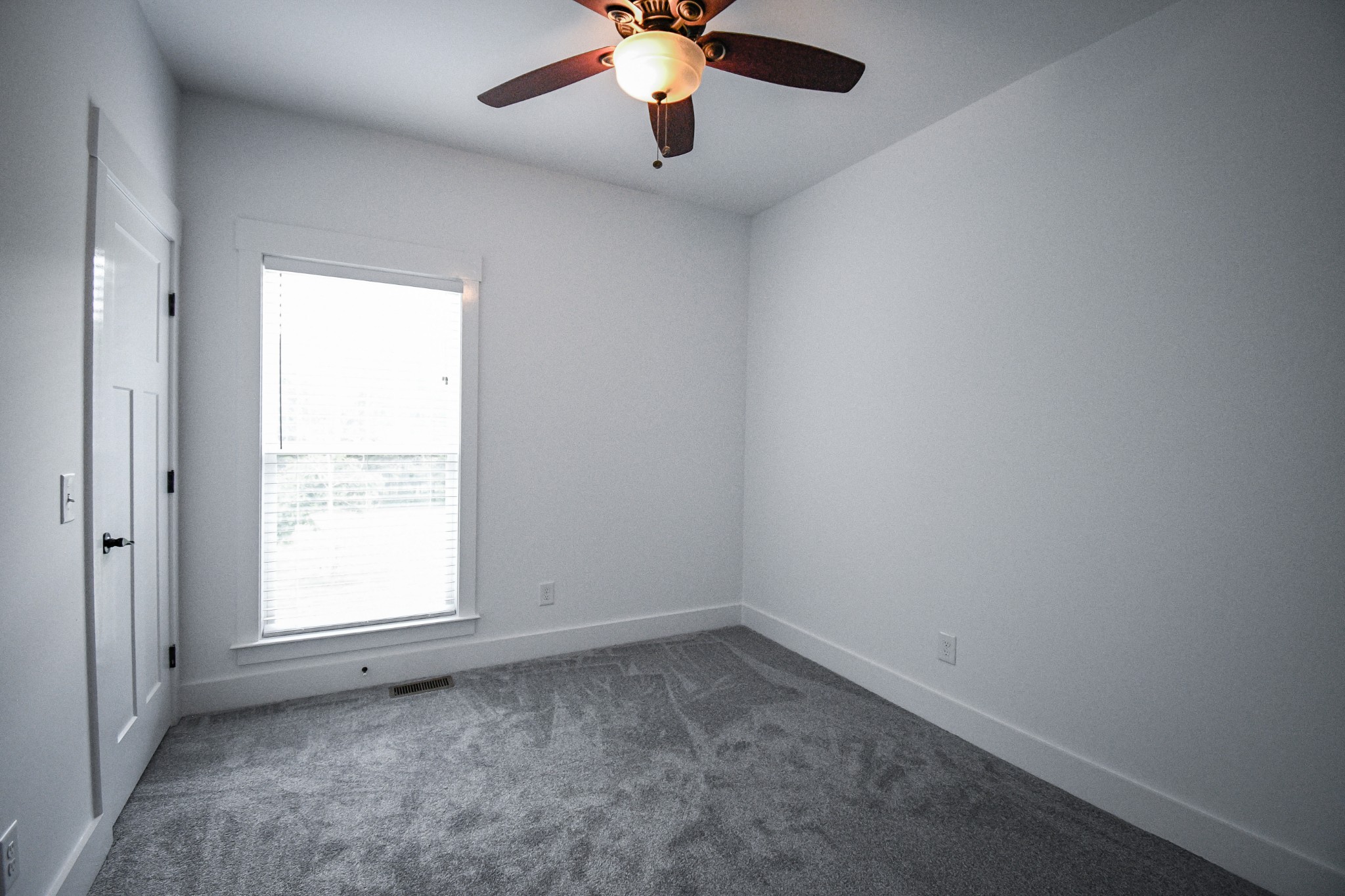 2848 Carpenter Bridge Road Columbia, TN 38401 - Photo 19 of 46 wooden floor in an empty room with a window