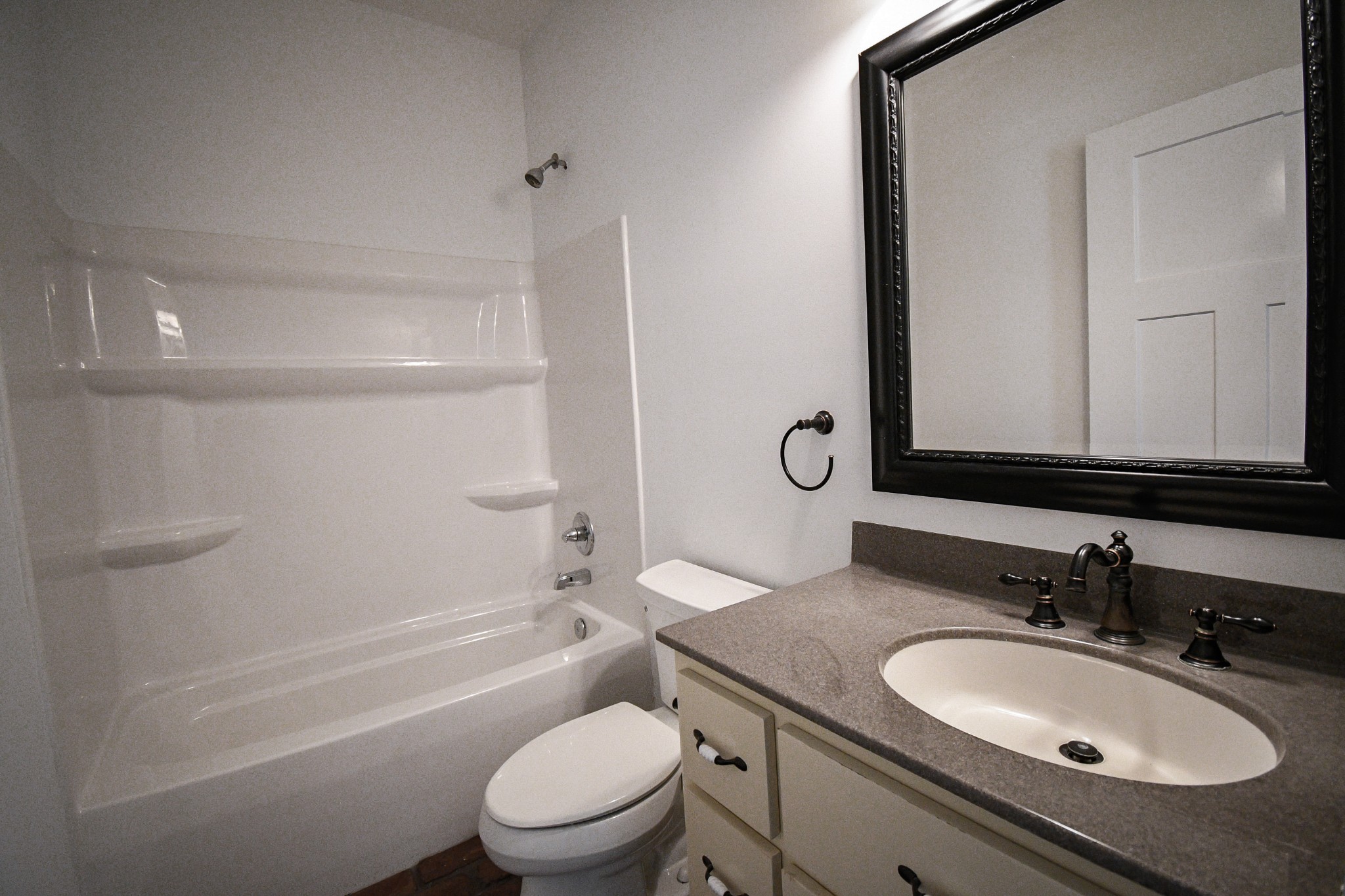 2848 Carpenter Bridge Road Columbia, TN 38401 - Photo 20 of 46 a bathroom with a granite countertop sink toilet a mirror and shower