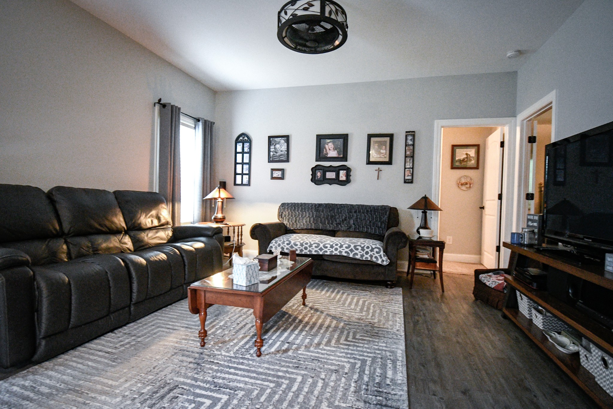 2848 Carpenter Bridge Road Columbia, TN 38401 - Photo 33 of 46 a living room with furniture and a flat screen tv