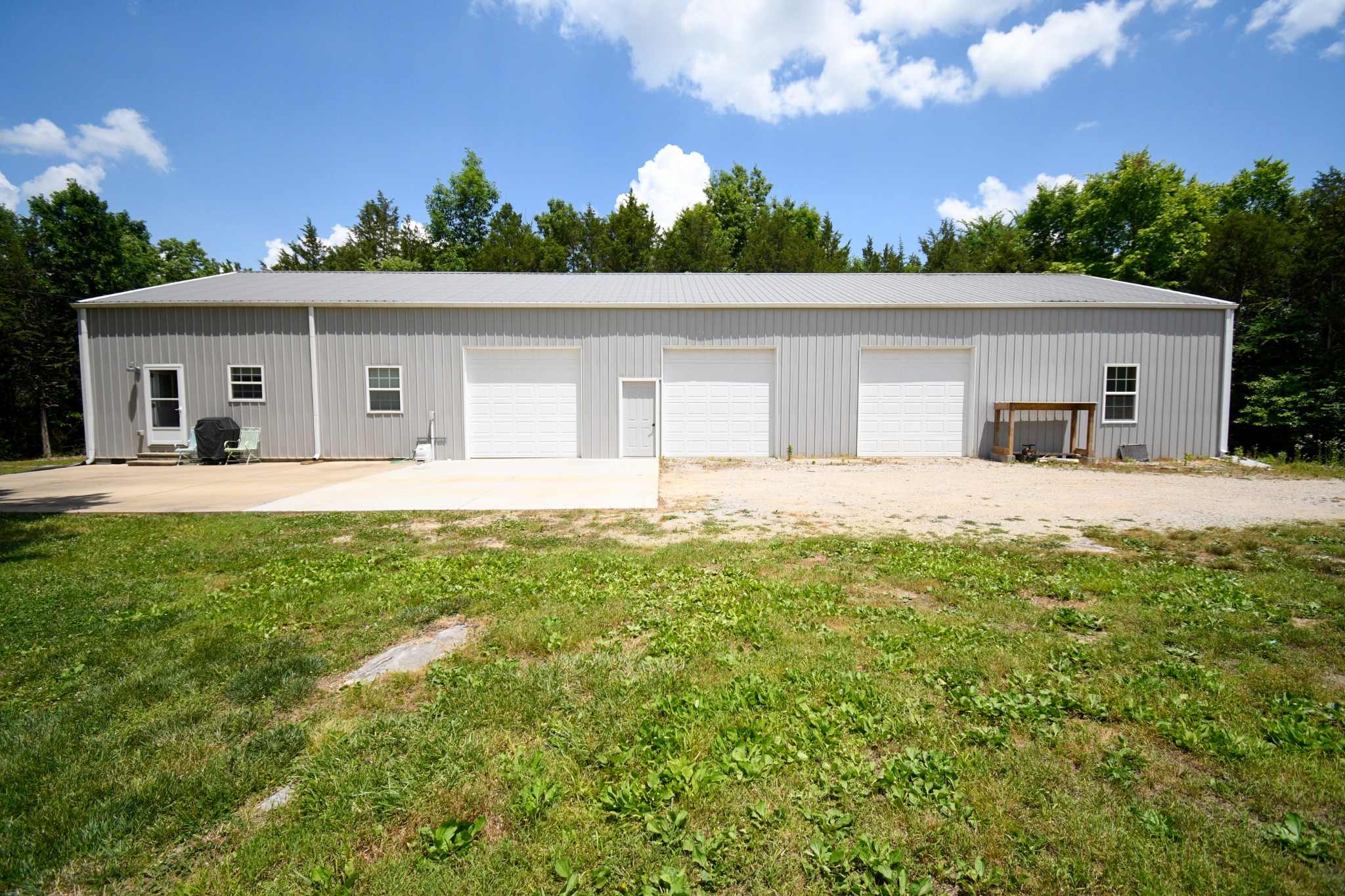 2848 Carpenter Bridge Road Columbia, TN 38401 - Photo 42 of 46 a house with green field in front of it