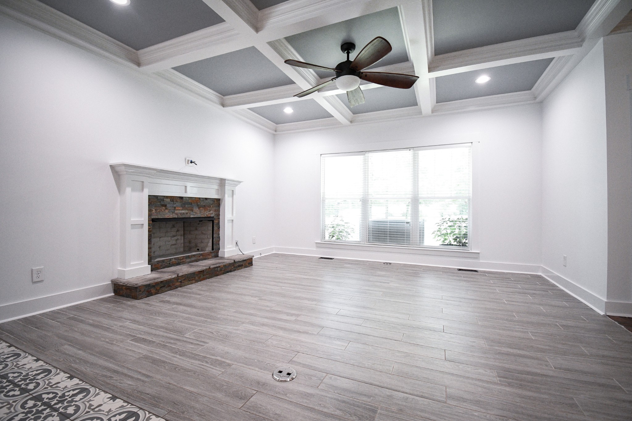 2848 Carpenter Bridge Road Columbia, TN 38401 - Photo 6 of 46 an empty room with wooden floor fireplace and windows