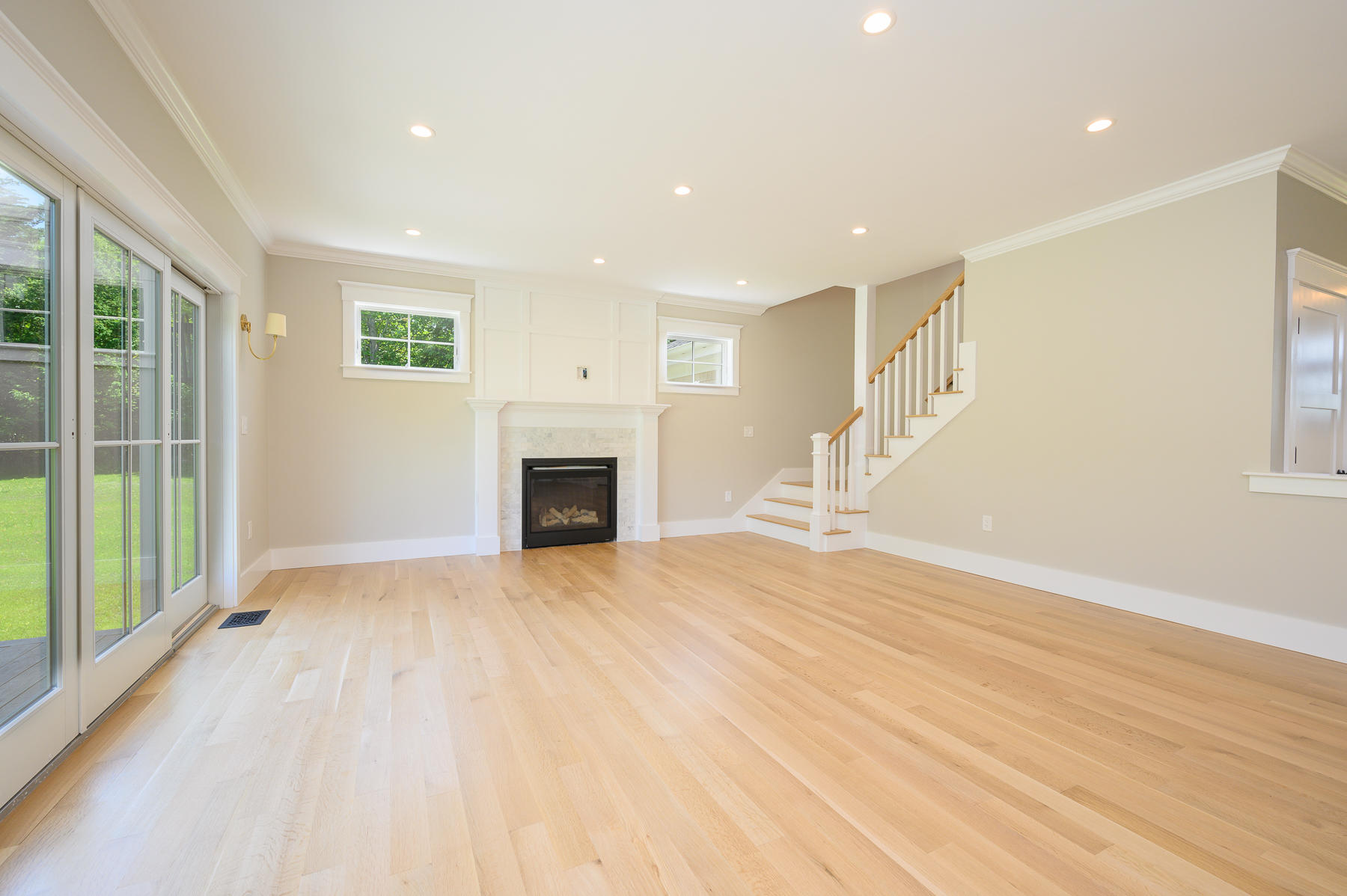 164 Breakwater Road Brewster, MA 02631 - Photo 13 of 57 a view of empty room with wooden floor and fireplace
