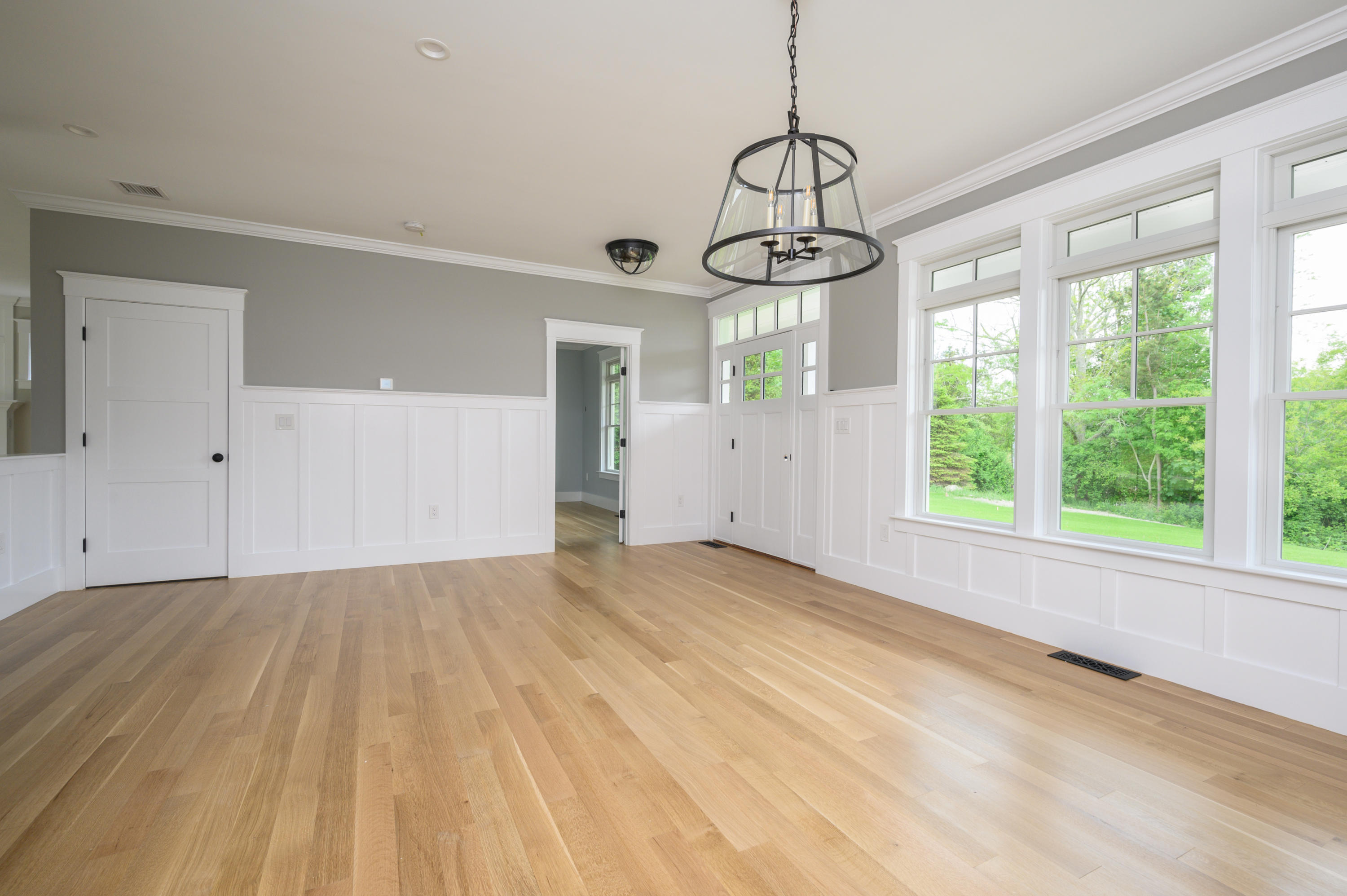 164 Breakwater Road Brewster, MA 02631 - Photo 20 of 57 a view of a room with a window and chandelier