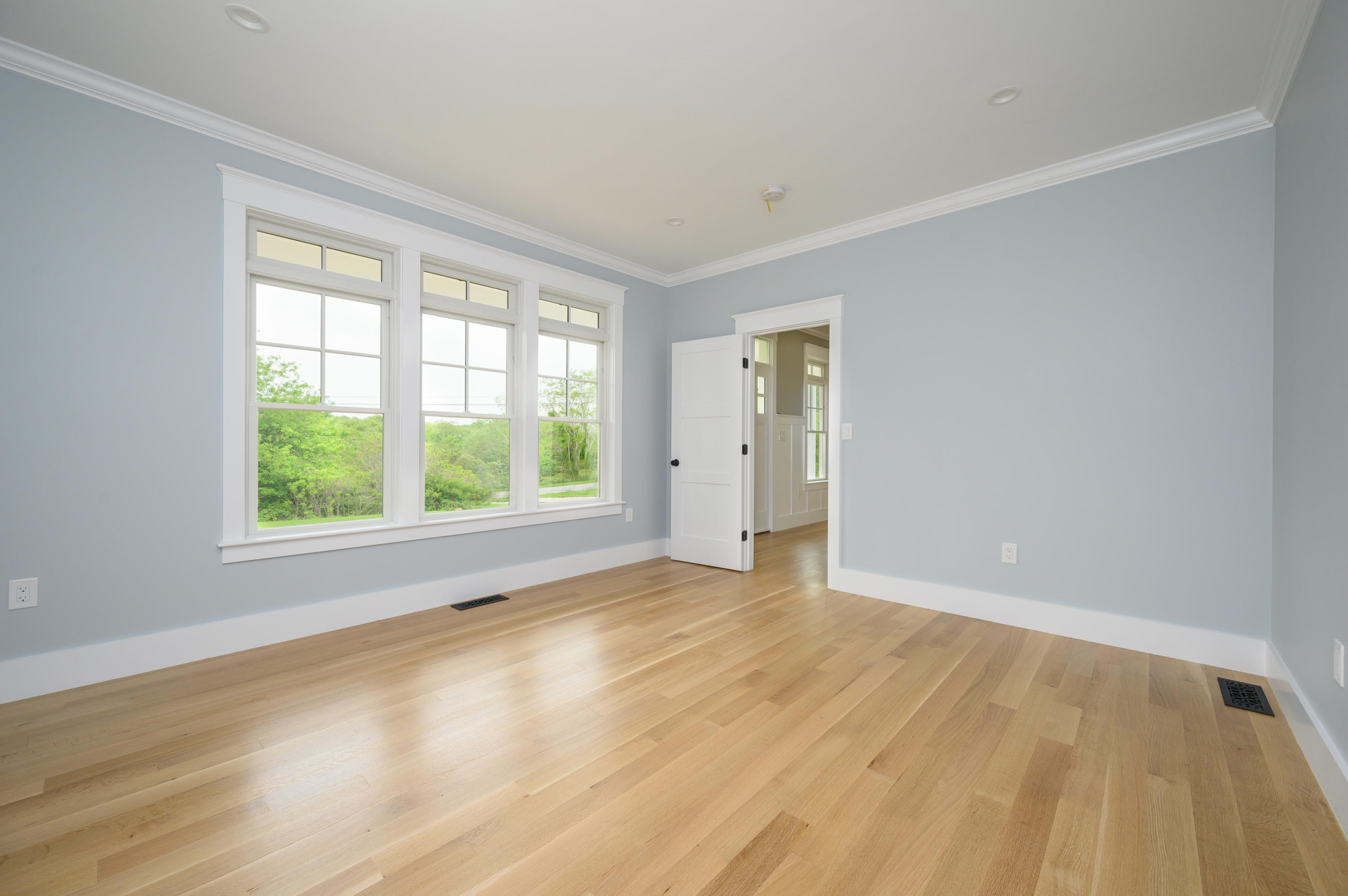 164 Breakwater Road Brewster, MA 02631 - Photo 22 of 57 a view of an empty room with wooden floor and a window