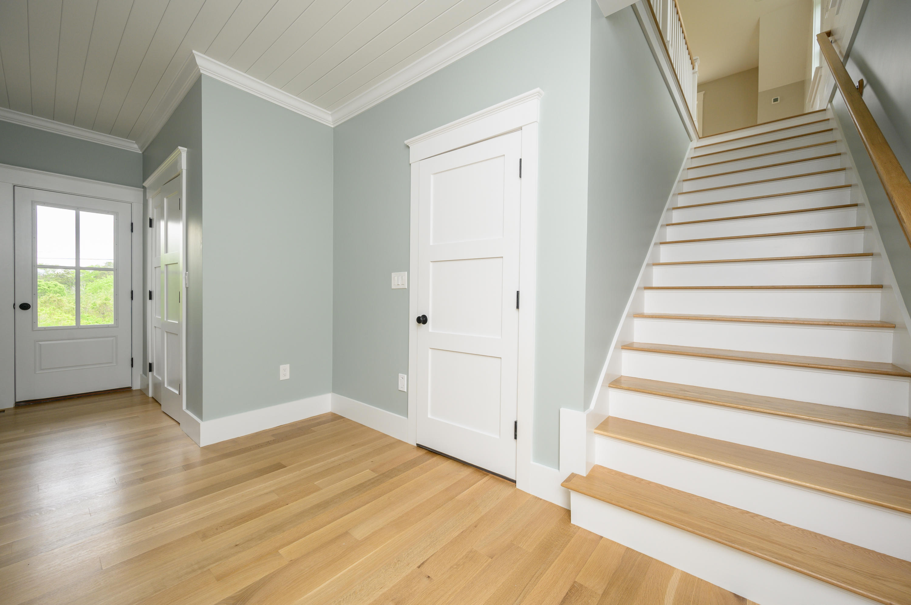 164 Breakwater Road Brewster, MA 02631 - Photo 26 of 57 a view of an entryway with wooden floor and stairs