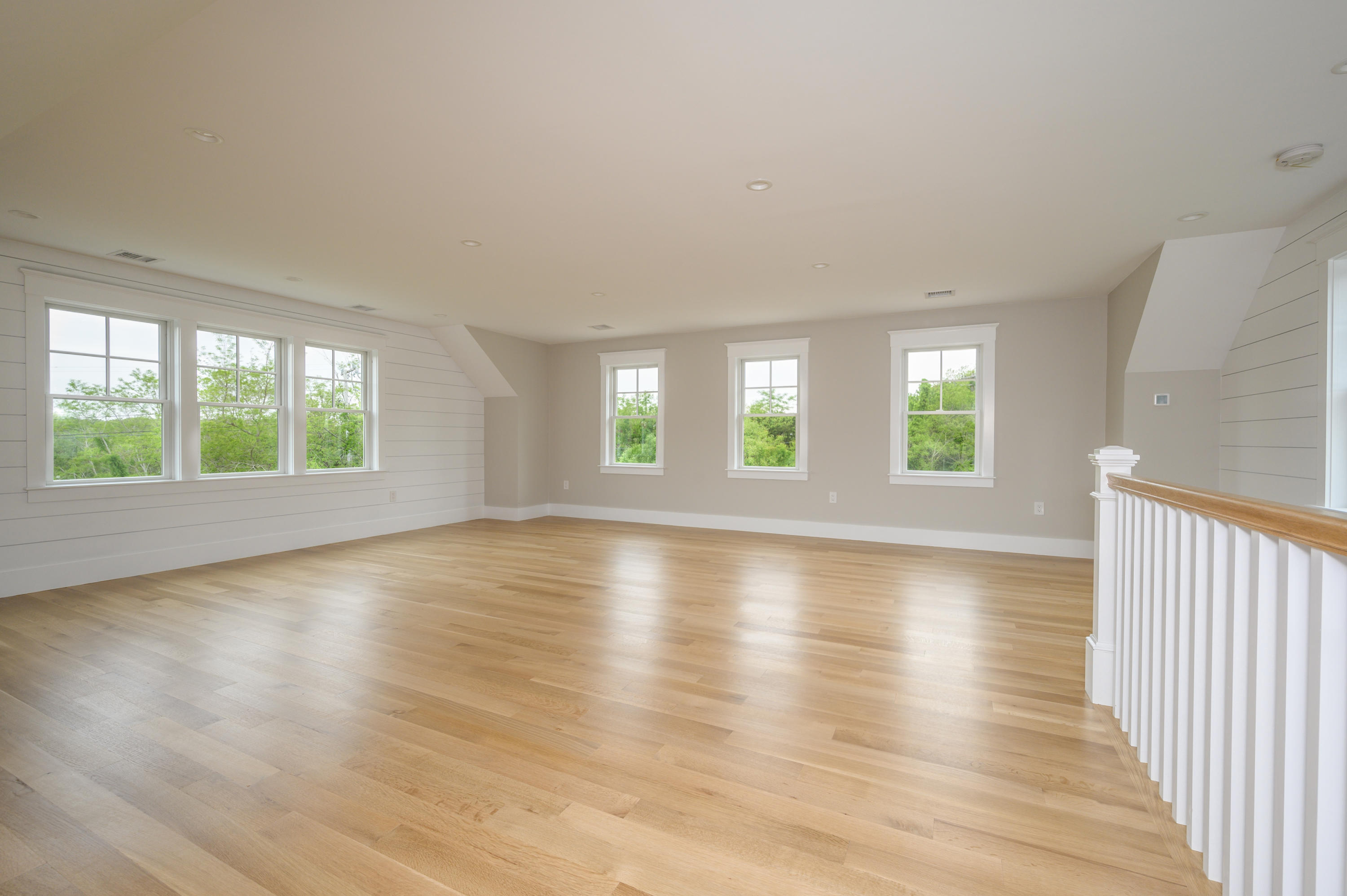 164 Breakwater Road Brewster, MA 02631 - Photo 27 of 57 an empty room with wooden floor and windows