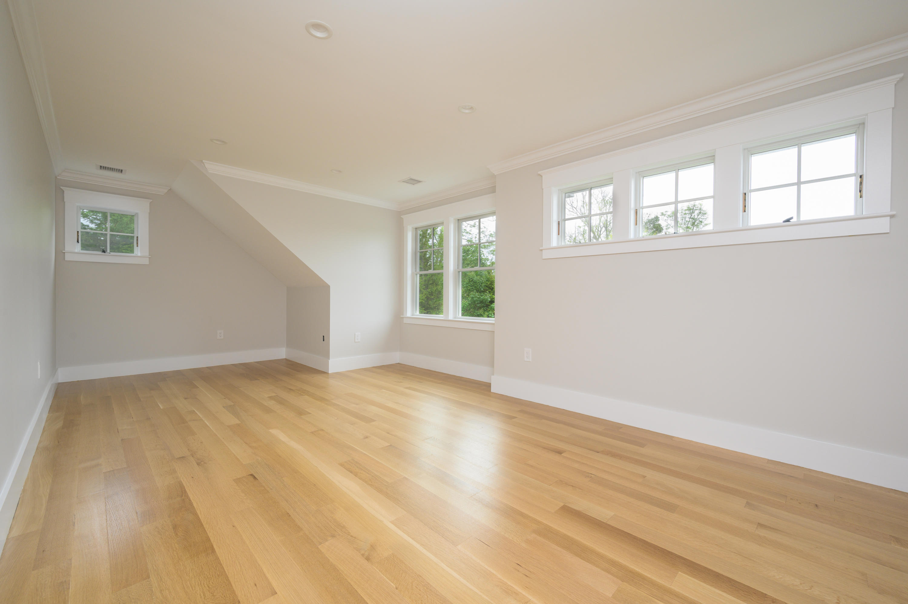 164 Breakwater Road Brewster, MA 02631 - Photo 36 of 57 a view of an empty room with wooden floor and a window