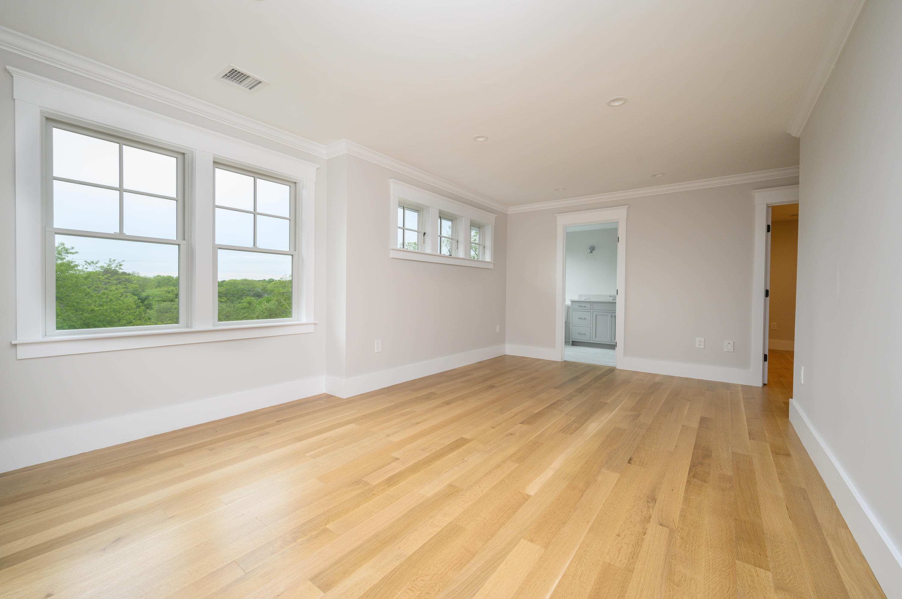 164 Breakwater Road Brewster, MA 02631 - Photo 37 of 57 a view of empty room with wooden floor and fan