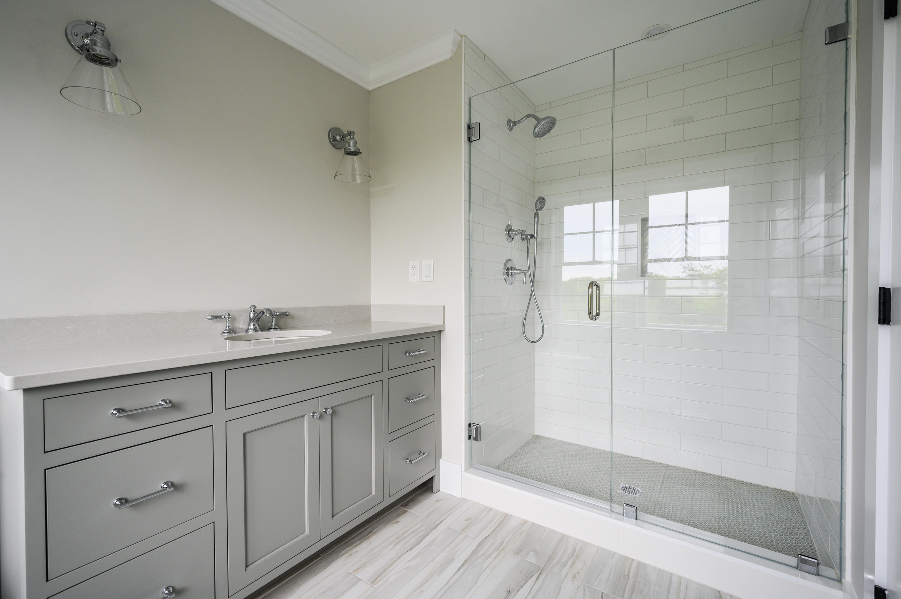 164 Breakwater Road Brewster, MA 02631 - Photo 41 of 57 a bathroom with a shower sink and mirror