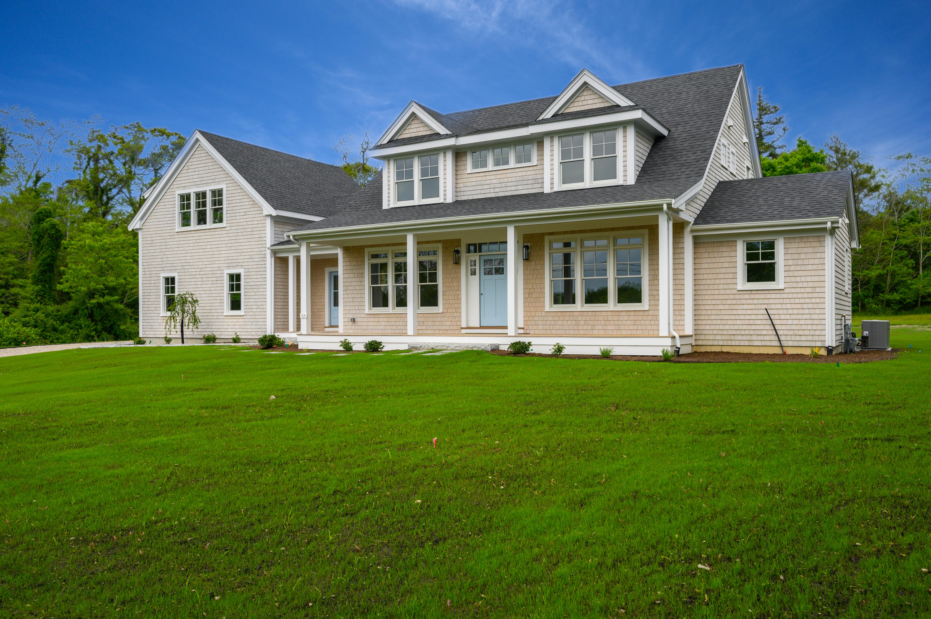 164 Breakwater Road Brewster, MA 02631 - Photo 5 of 57 a front view of a house with a garden