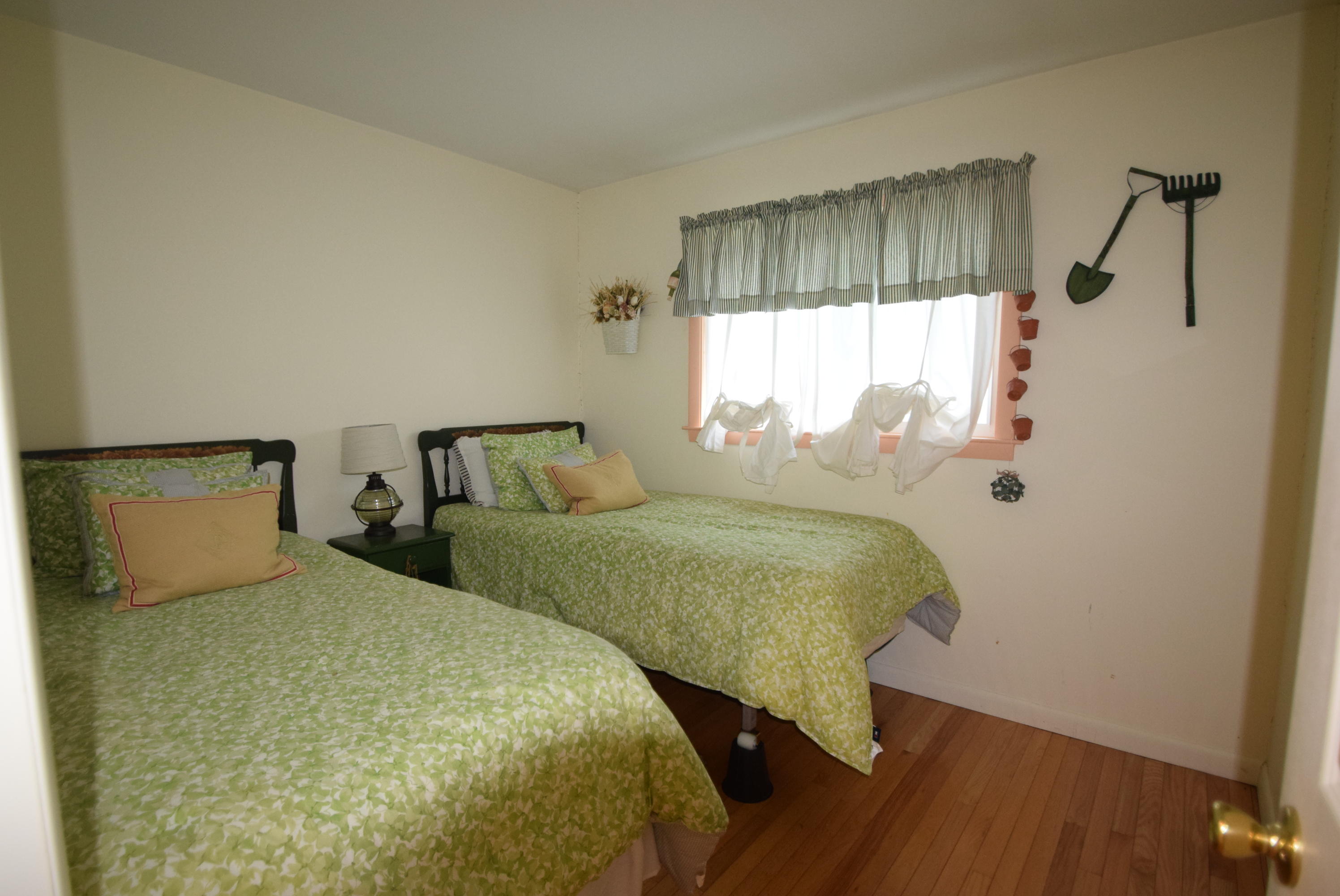 164 Breakwater Road Brewster, MA 02631 - Photo 51 of 57 a bedroom with two beds and wooden floor