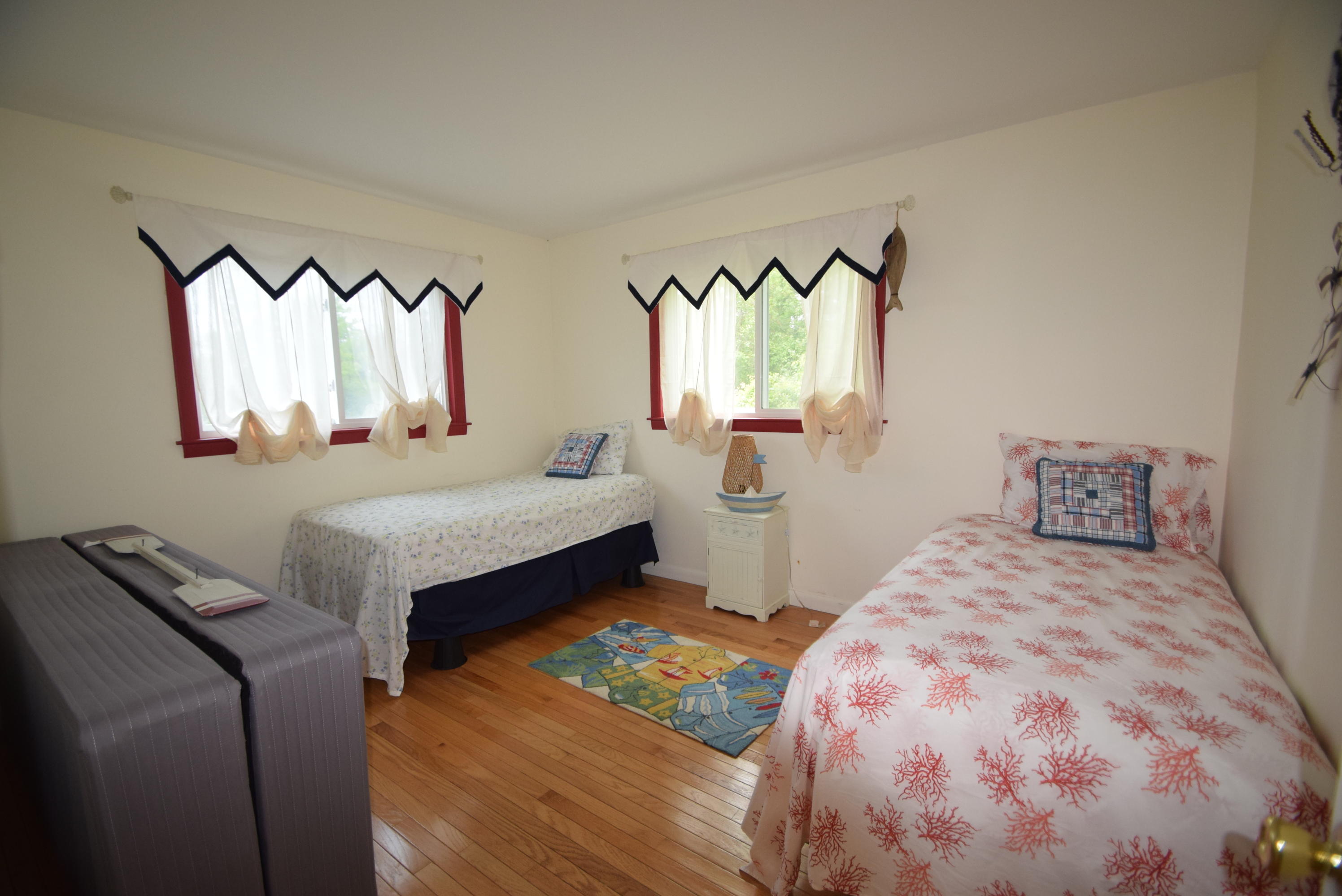 164 Breakwater Road Brewster, MA 02631 - Photo 52 of 57 a bedroom with a bed and a dresser