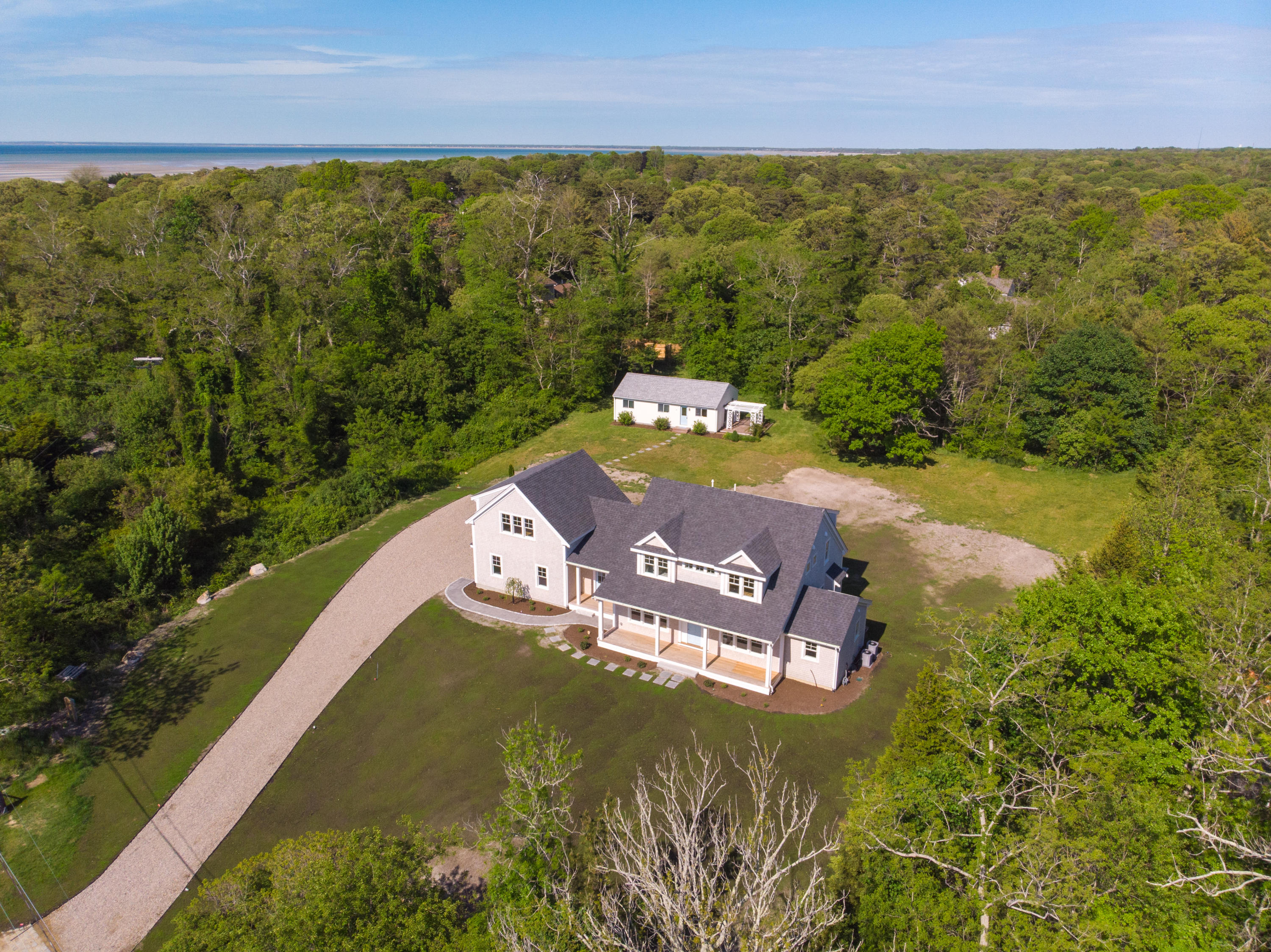 164 Breakwater Road Brewster, MA 02631 - Photo 55 of 57 an aerial view of residential houses with outdoor space and swimming pool