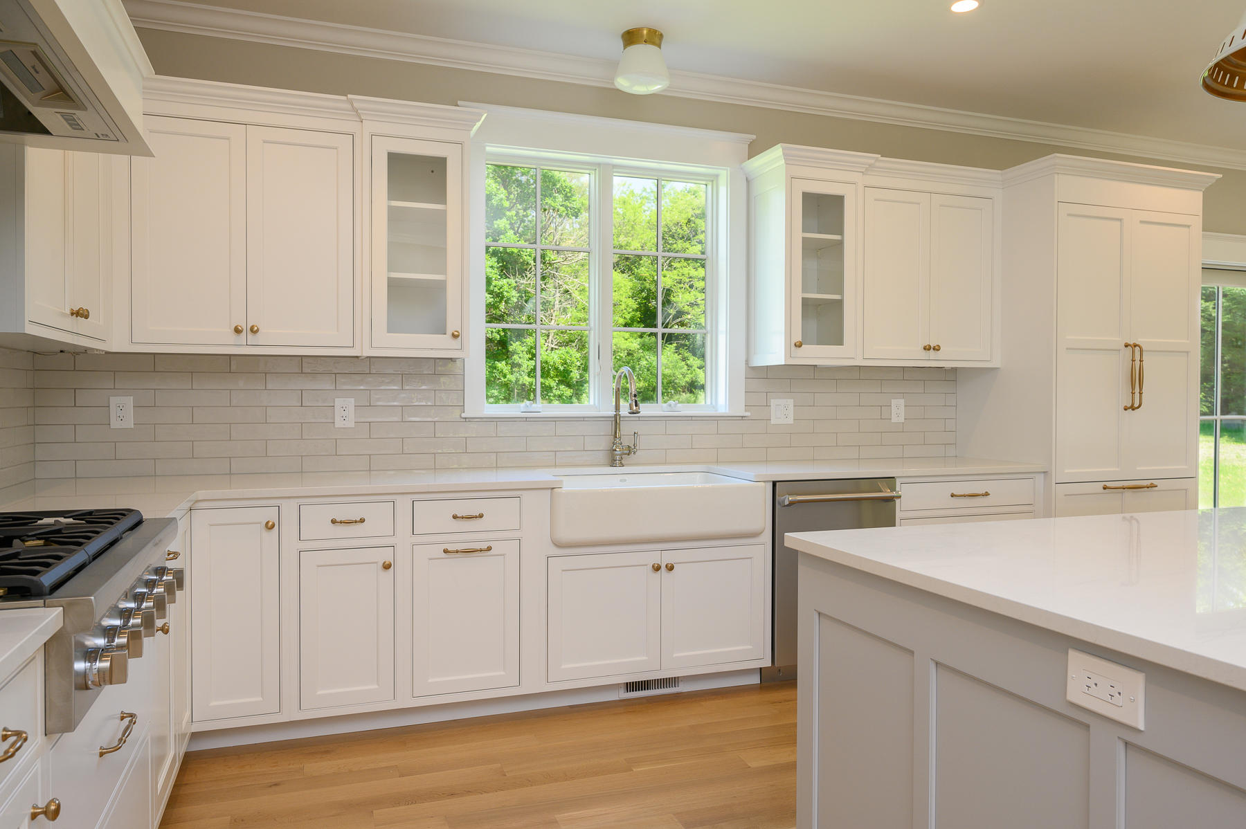 164 Breakwater Road Brewster, MA 02631 - Photo 8 of 57 a kitchen with granite countertop white cabinets and a window