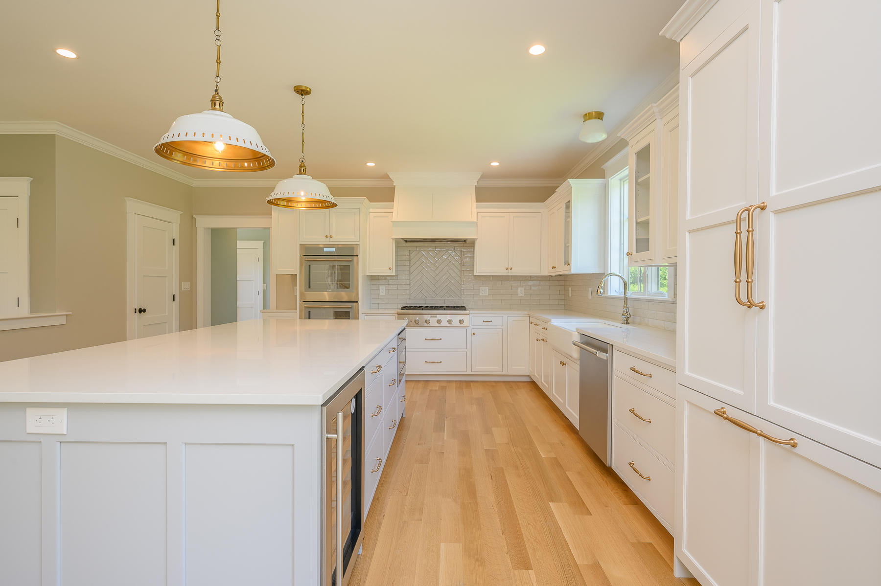 164 Breakwater Road Brewster, MA 02631 - Photo 10 of 57 a kitchen with stainless steel appliances a stove a refrigerator a sink and white cabinets