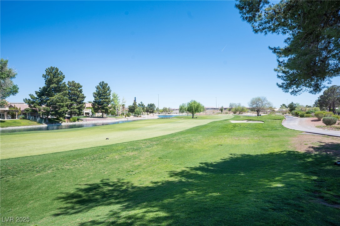 7625 Rolling View Drive, Unit 202 Las Vegas, NV 89149 - Photo 13 of 28 View of property's community with golf course view, a yard, and a water view