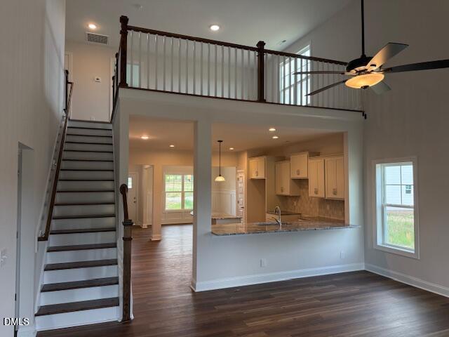 204 North Rabbit Run Drive Smithfield, NC 27577 - Photo 6 of 19 a view of an entryway with wooden floor and a chandelier