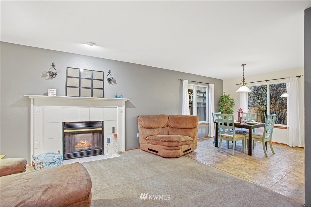 22412 15th Place West Bothell, WA 98021 - Photo 3 of 25 a living room with furniture and a fireplace