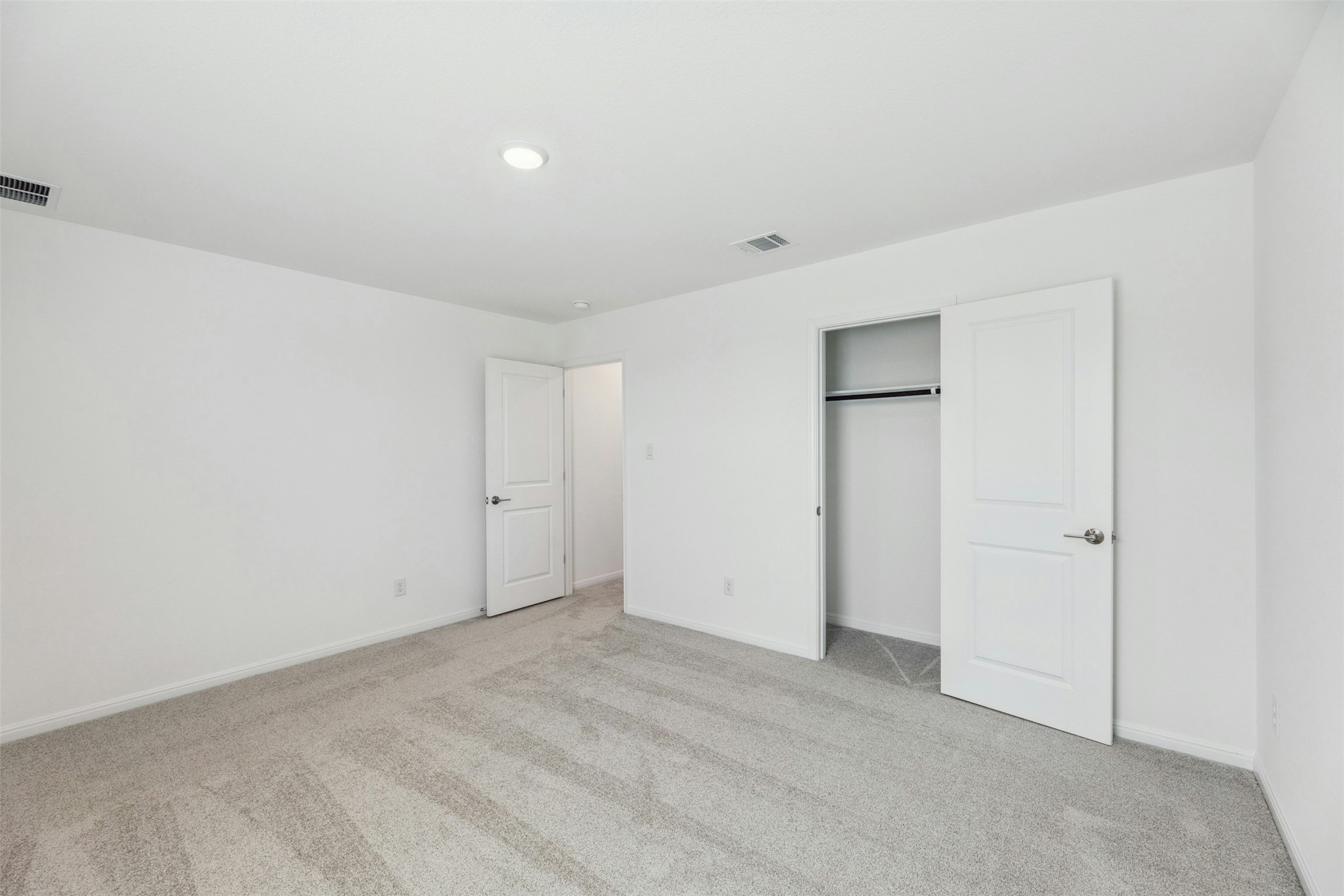 2001 Wynn Road Hutto, TX 78634 - Photo 28 of 39 A spacious, naturally illuminated room features plush carpeting and convenient closet access.