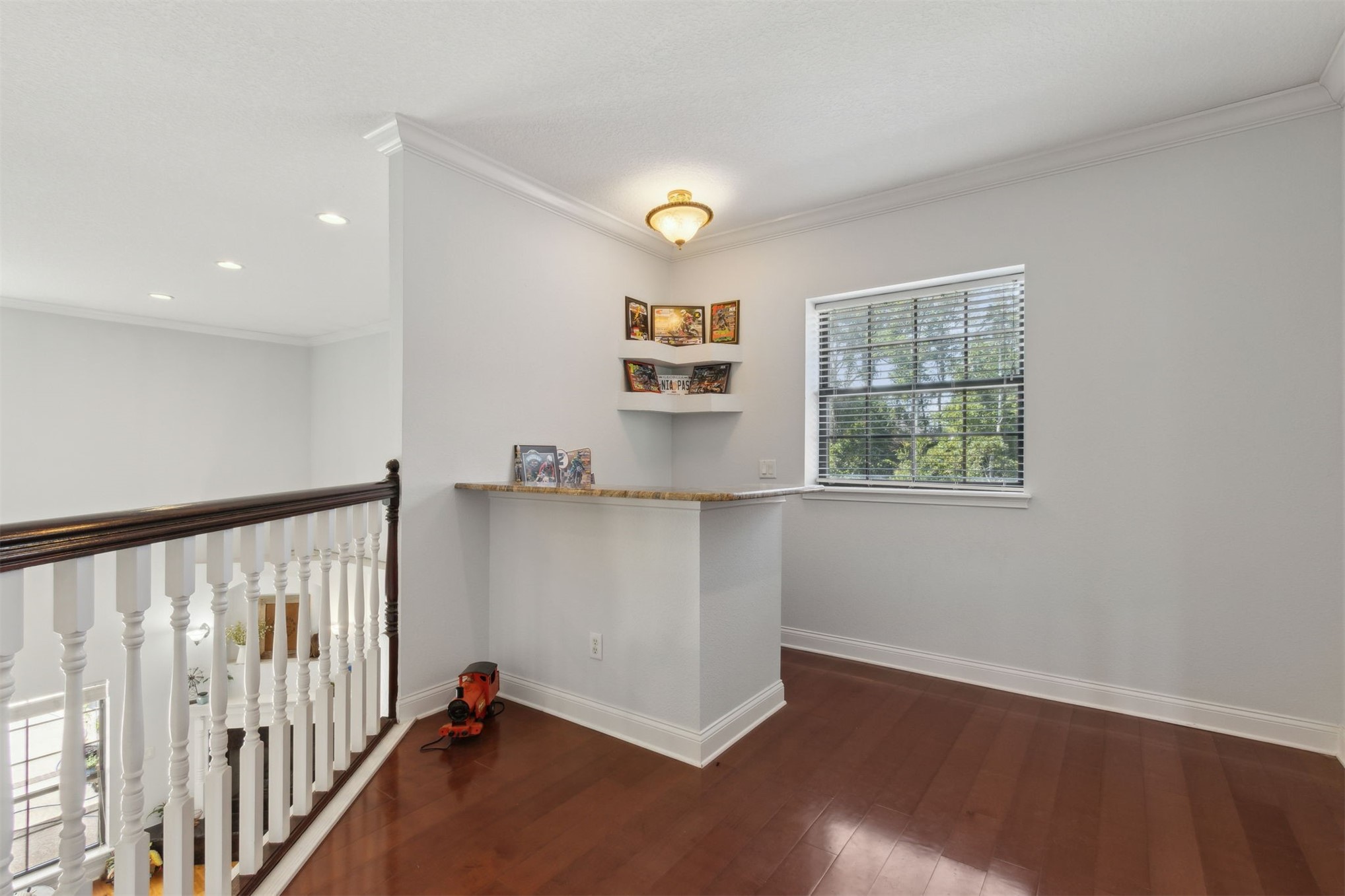 87377 Raddin Road Yulee, FL 32097 - Photo 53 of 75 a view of a hallway with wooden floor and a window