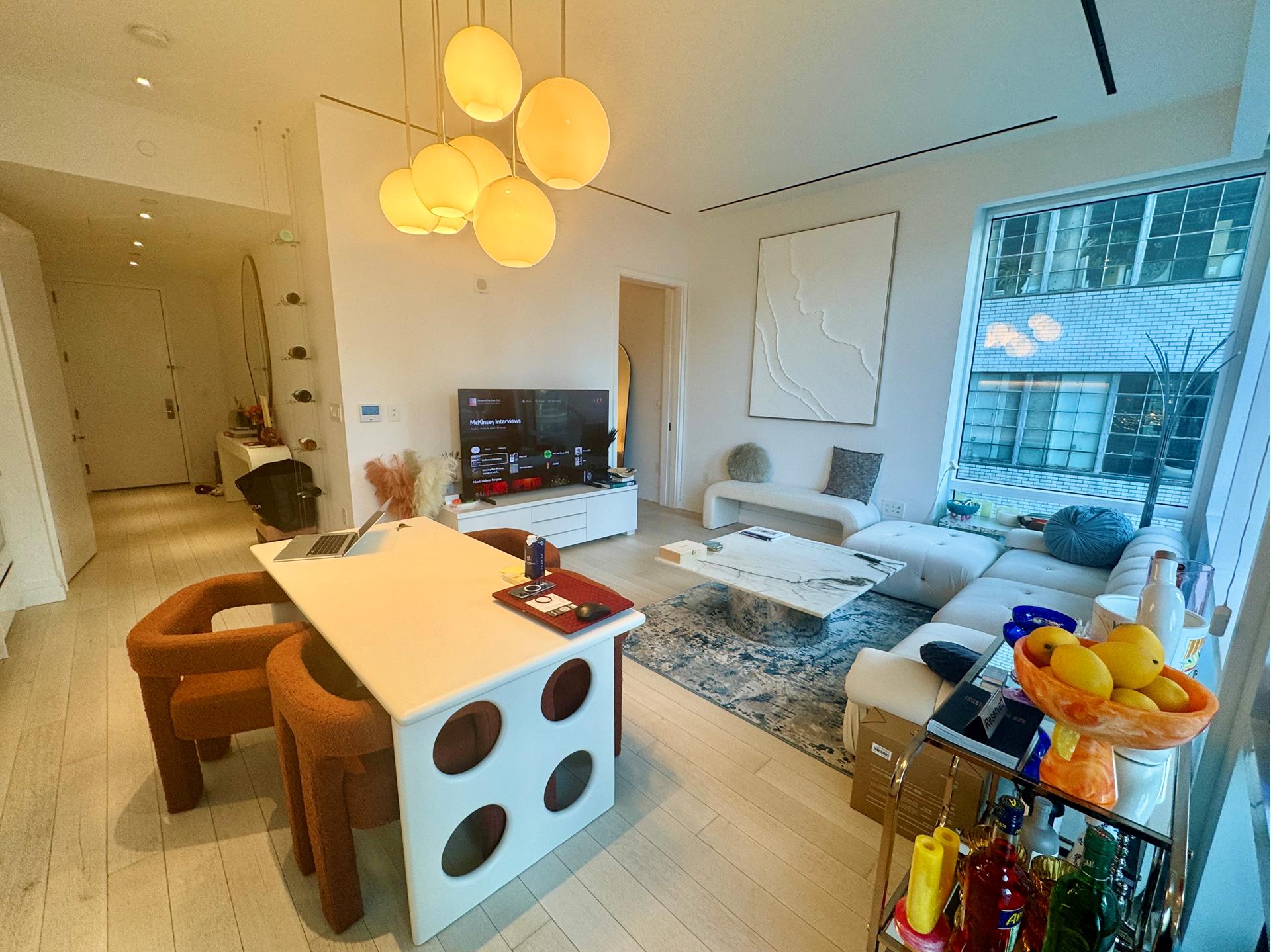 200 East 59th Street, Unit 8B Manhattan, NY 10022 - Photo 6 of 21 a living room with furniture and a flat screen tv