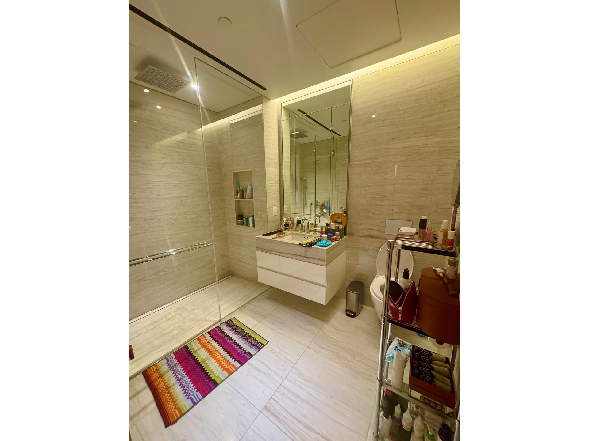 200 East 59th Street, Unit 8B Manhattan, NY 10022 - Photo 7 of 21 a bathroom with a sink and a mirror