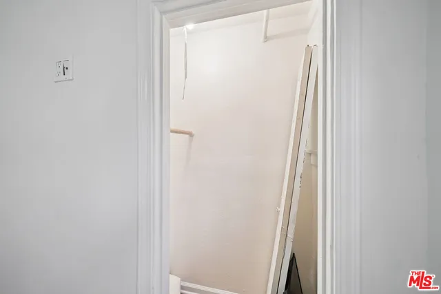a bathroom with a glass shower door