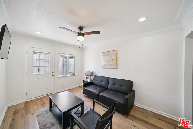 a living room with furniture and a window
