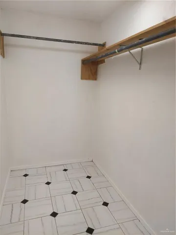 a bathroom with a sink toilet and a mirror