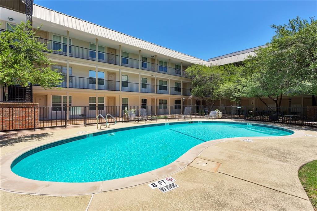910 Duncan Lane, Unit 35 Austin, TX 78705 - Photo 15 of 20 An inviting swimming pool and ample lounging areas complement this well-maintained residential building.