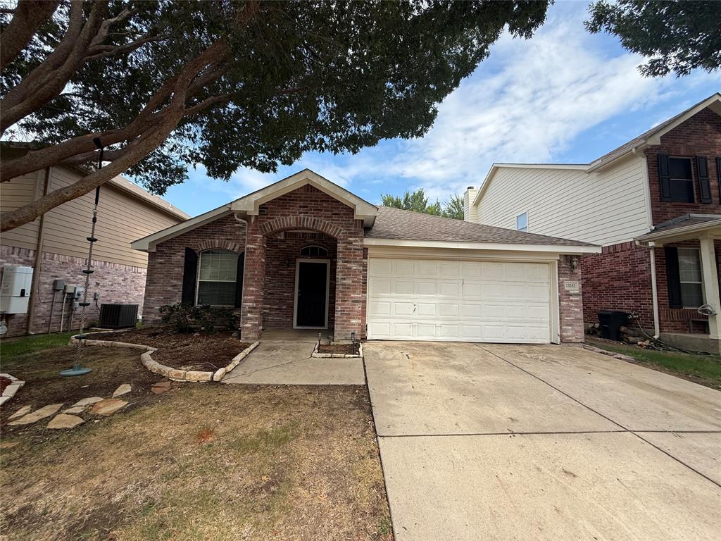 13252 Ridgepointe Road Fort Worth, TX 76244 - Photo 1 of 9 a front view of a house with a garage