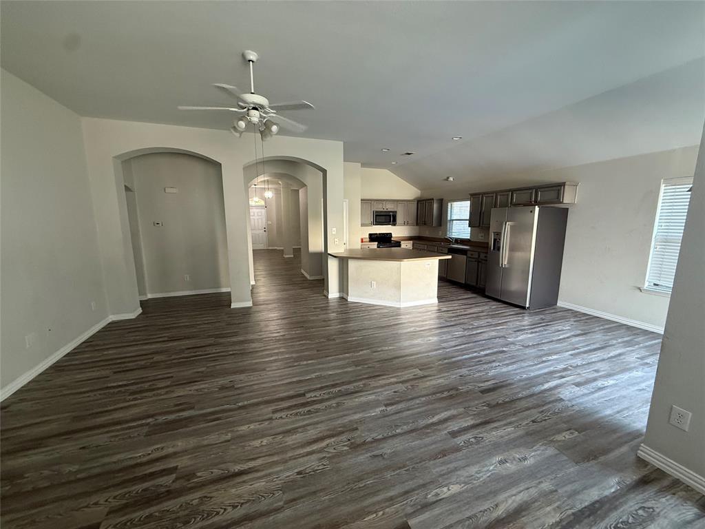 13252 Ridgepointe Road Fort Worth, TX 76244 - Photo 9 of 9 a view of a kitchen with wooden floor and a ceiling fan