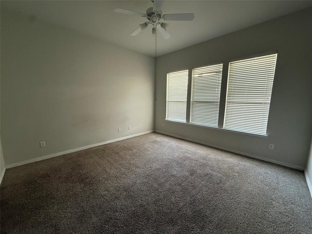 13252 Ridgepointe Road Fort Worth, TX 76244 - Photo 6 of 9 an empty room with a empty space and windows