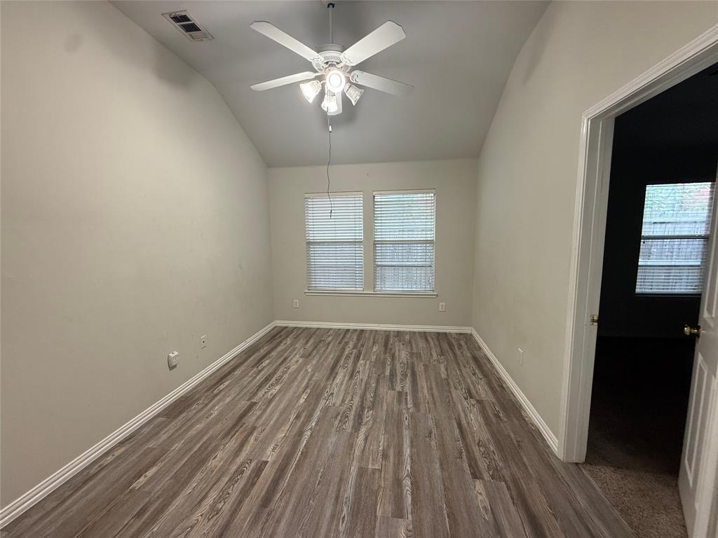 13252 Ridgepointe Road Fort Worth, TX 76244 - Photo 7 of 9 wooden floor in an empty room with a window