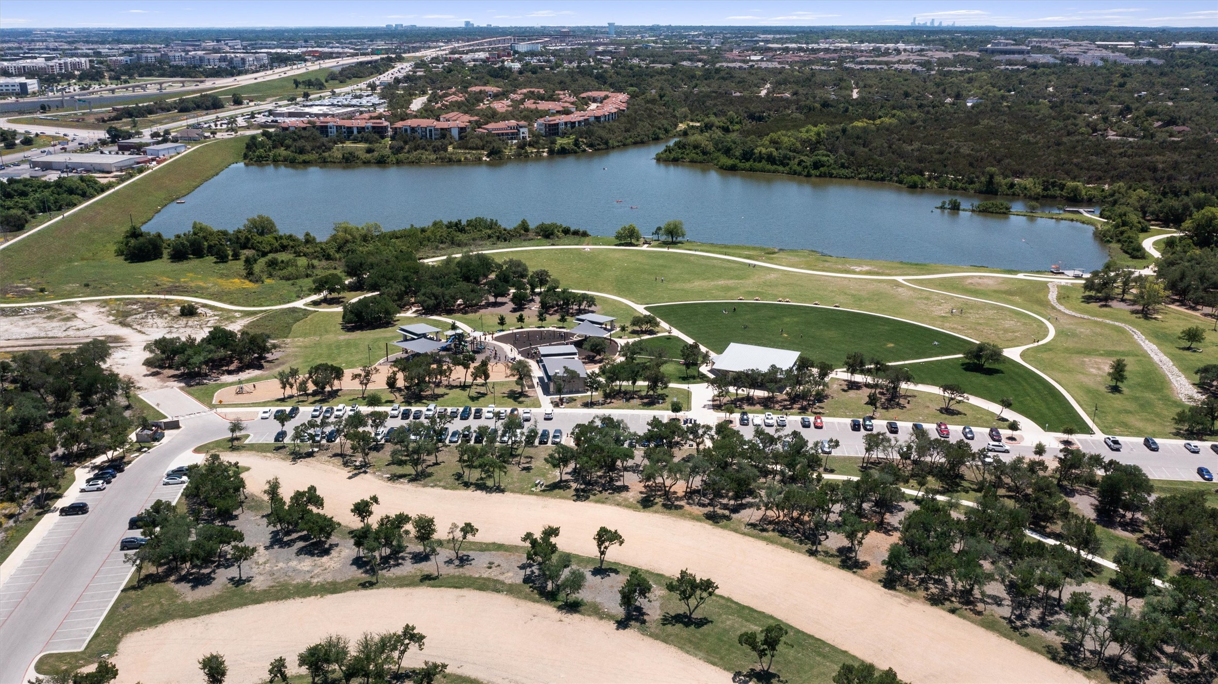 590 Old Mill Road, Unit 153 Cedar Park, TX 78613 - Photo 32 of 40 an aerial view of a houses with a lake