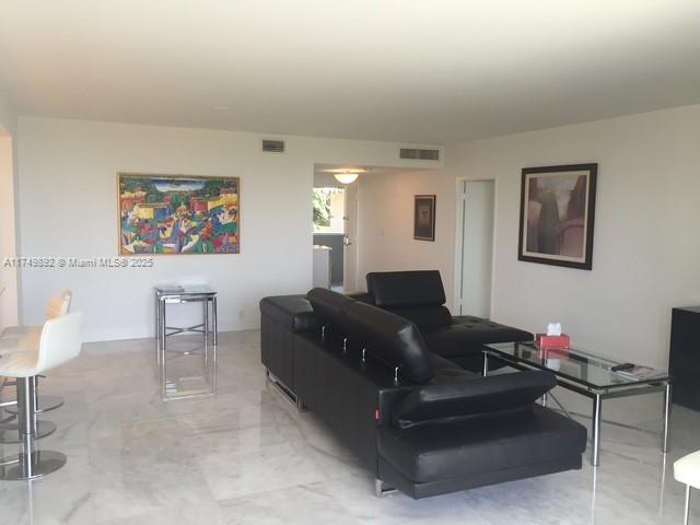 101 Crandon Boulevard, Unit 474 Key Biscayne, FL 33149 - Photo 2 of 9 a living room with furniture