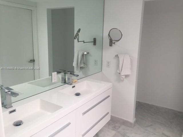 101 Crandon Boulevard, Unit 474 Key Biscayne, FL 33149 - Photo 7 of 9 a bathroom with a sink and a mirror